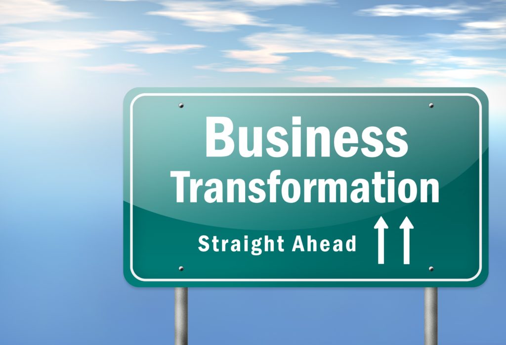 Green sign that says Business Transformation ahead for change management.